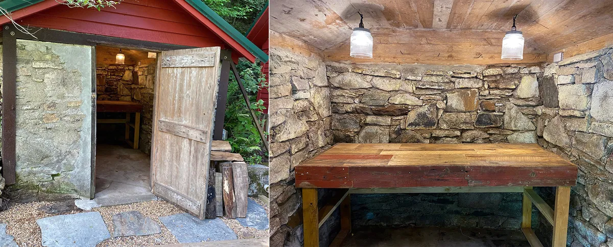 This image shows a cozy interior space featuring a sturdy wooden door, rustic stone walls, and a practical wooden table, evoking a sense of function and warmth. The setting is ideal for storing gear or preparing for outdoor adventures, capturing the spirit of a lodge tailored to active, season-focused living.